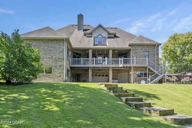 back of property with a lawn, a wooden deck, and a garage