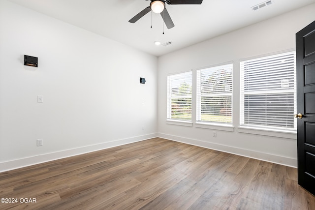 spare room with ceiling fan and hardwood / wood-style floors