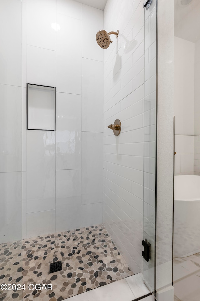 bathroom featuring an enclosed shower