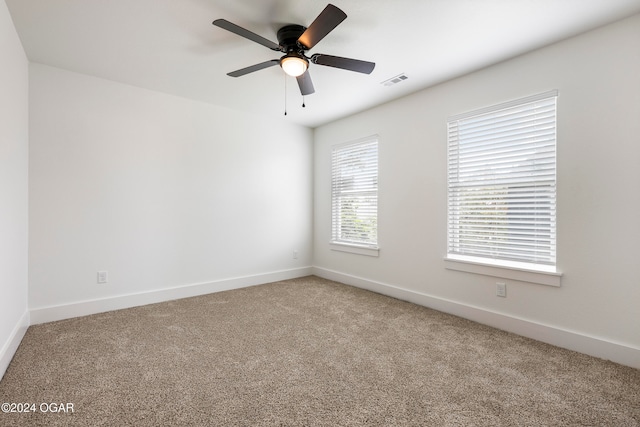 spare room with carpet flooring and ceiling fan