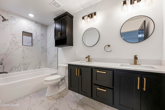 full bathroom featuring vanity, toilet, and tiled shower / bath