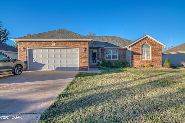 single story home with a front lawn and a garage