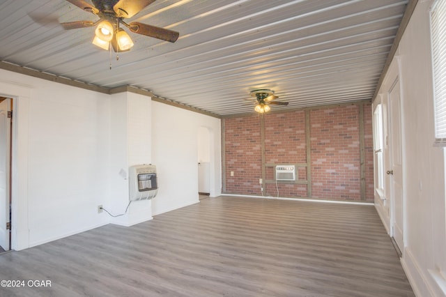 319-323 N Harlem Ave, Joplin, MO 64801 - unfurnished sunroom with heating unit, a wall unit AC, and arched walkways