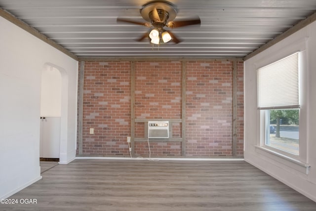 319-323 N Harlem Ave, Joplin, MO 64801 - unfurnished sunroom featuring an AC wall unit and arched walkways