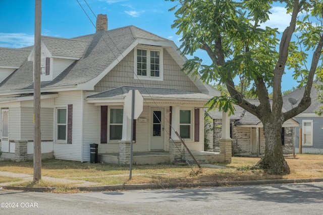 319-323 N Harlem Ave, Joplin, MO 64801 - view of front of property with roof with shingles and a chimney