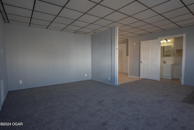319-323 N Harlem Ave, Joplin, MO 64801 - spare room featuring light carpet and a drop ceiling