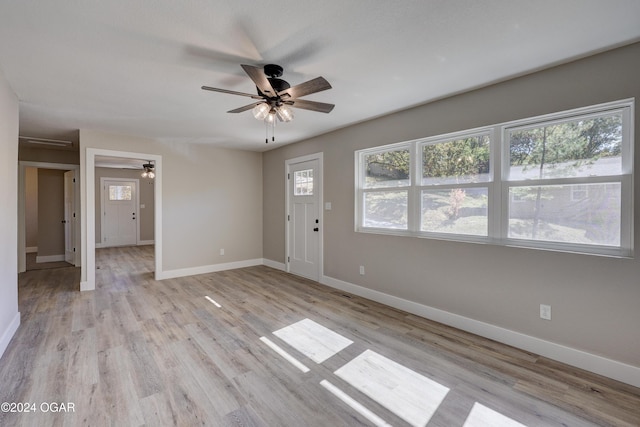 interior space with ceiling fan and light wood-type flooring