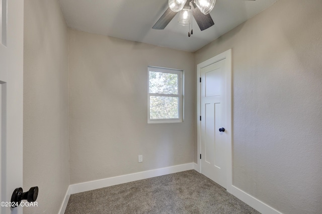 empty room with carpet flooring and ceiling fan