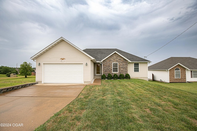 single story home with a front yard and a garage