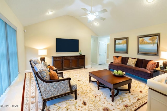 living room featuring ceiling fan and high vaulted ceiling