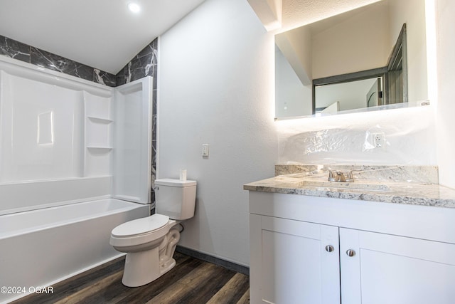 full bathroom featuring hardwood / wood-style flooring, vanity,  shower combination, and toilet