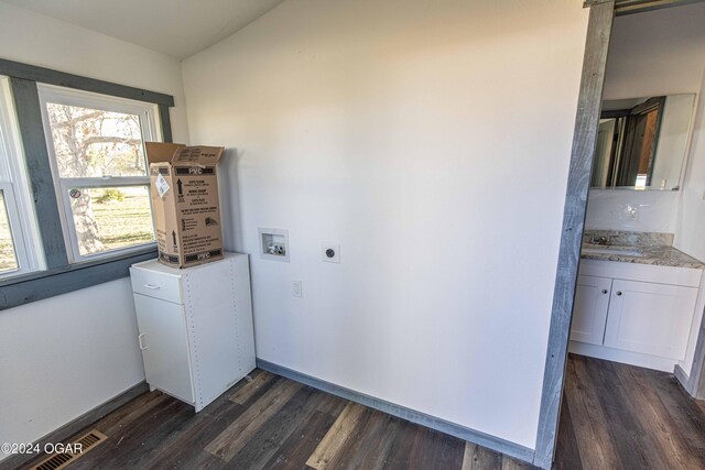 laundry room with hookup for an electric dryer, washer hookup, dark hardwood / wood-style floors, and sink