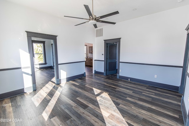 spare room featuring dark hardwood / wood-style flooring and ceiling fan