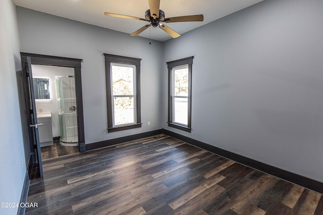 unfurnished room featuring dark hardwood / wood-style floors and ceiling fan