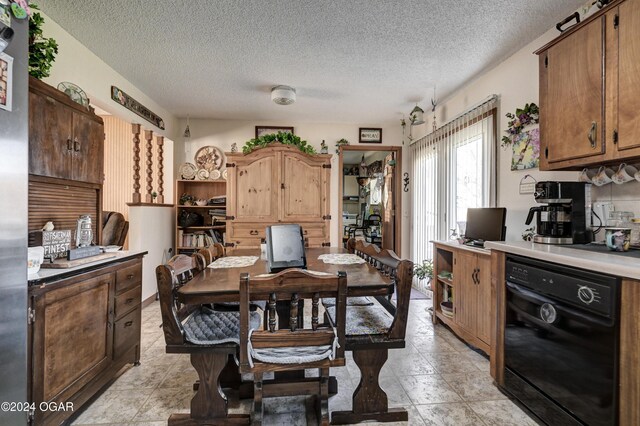 dining space with a textured ceiling