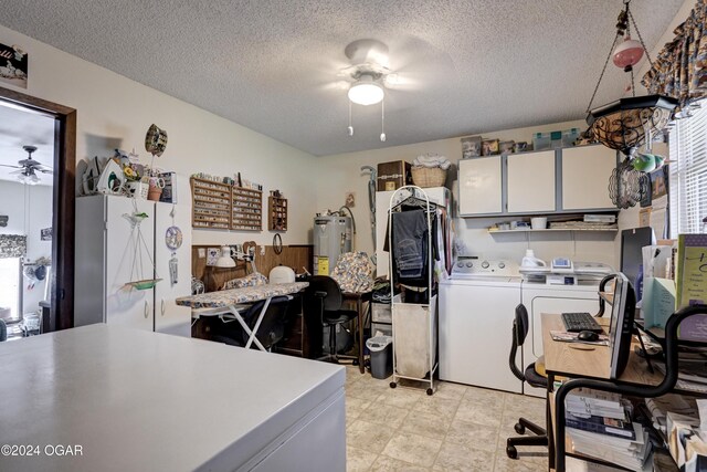 laundry area with ceiling fan, independent washer and dryer, a textured ceiling, and water heater