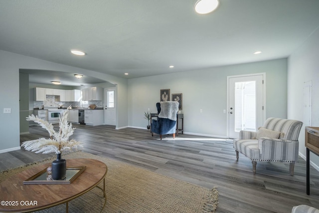 living room featuring dark wood-type flooring