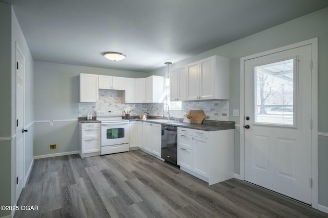 kitchen with dishwasher, white electric range oven, sink, white cabinets, and tasteful backsplash