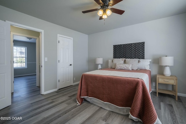 bedroom with ceiling fan and wood-type flooring