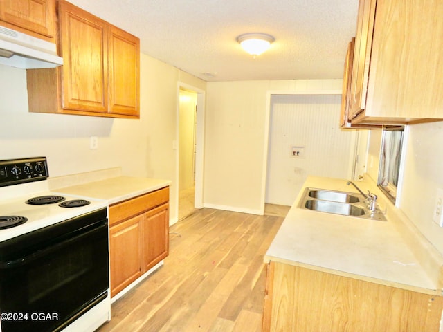 kitchen featuring sink, white electric stove, light hardwood / wood-style flooring, a textured ceiling, and range hood