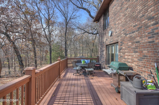 5623 Rivercrest Valley Dr, Joplin, MO 64804 - wooden terrace featuring a grill and outdoor dining space