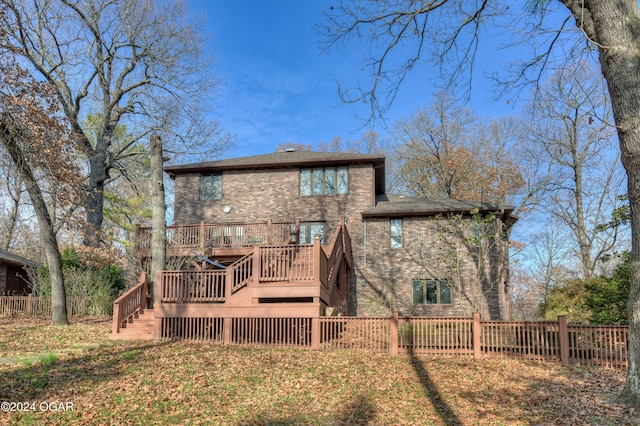 5623 Rivercrest Valley Dr, Joplin, MO 64804 - back of house featuring stairs, a wooden deck, and brick siding