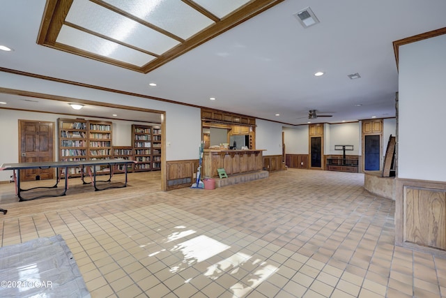 5623 Rivercrest Valley Dr, Joplin, MO 64804 - unfurnished living room with a wainscoted wall, recessed lighting, a ceiling fan, and ornamental molding
