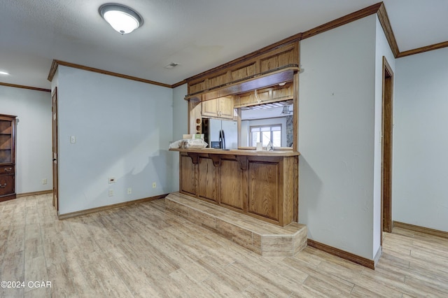 5623 Rivercrest Valley Dr, Joplin, MO 64804 - bar area with ornamental molding, fridge with ice dispenser, and light wood-type flooring