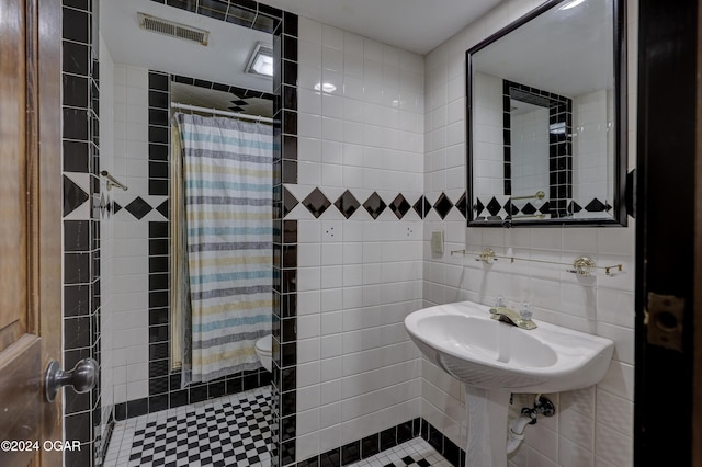 5623 Rivercrest Valley Dr, Joplin, MO 64804 - bathroom featuring a tile shower and tile walls