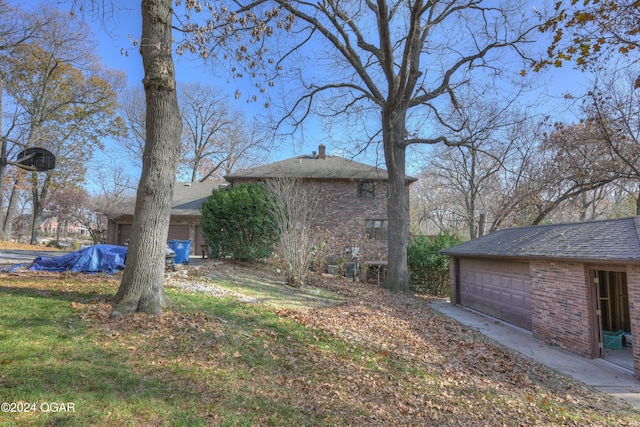 5623 Rivercrest Valley Dr, Joplin, MO 64804 - view of yard with an outbuilding and a garage