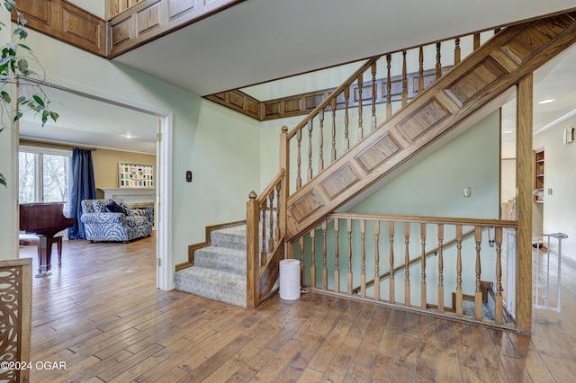 5623 Rivercrest Valley Dr, Joplin, MO 64804 - staircase with hardwood / wood-style flooring, ornamental molding, and recessed lighting
