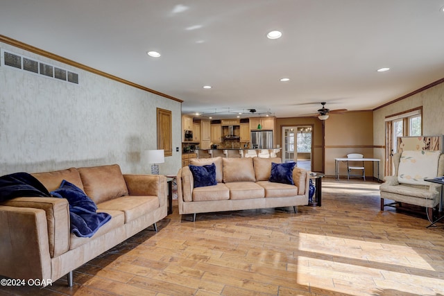 5623 Rivercrest Valley Dr, Joplin, MO 64804 - living area featuring crown molding, light wood finished floors, ceiling fan, and recessed lighting