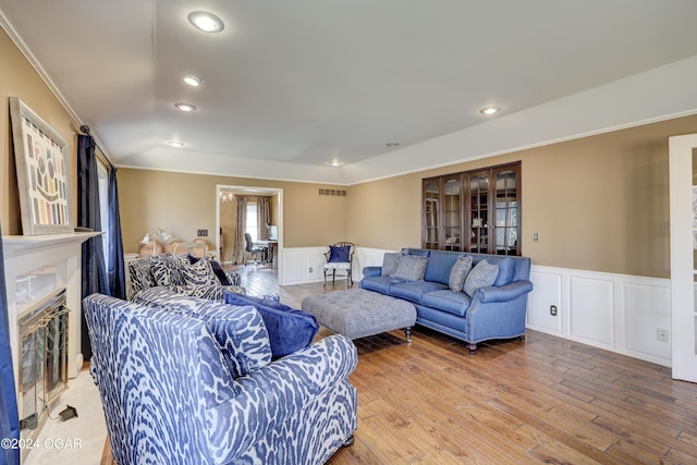 5623 Rivercrest Valley Dr, Joplin, MO 64804 - living room featuring a wainscoted wall, crown molding, recessed lighting, french doors, and a fireplace