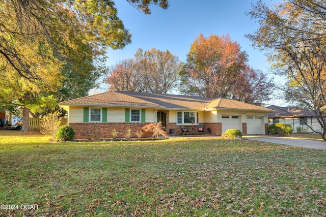 ranch-style home with a front yard and a garage