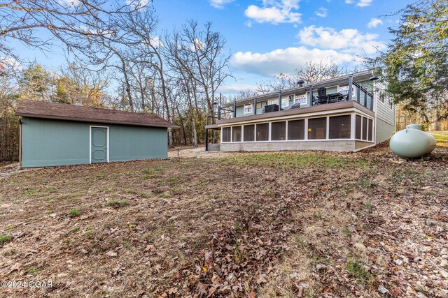 back of property featuring a sunroom