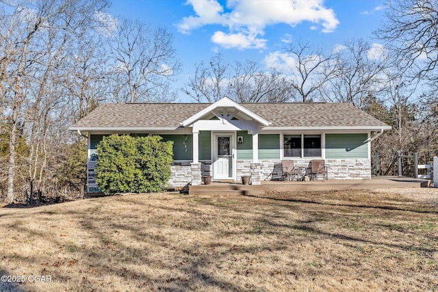 craftsman inspired home with a front lawn