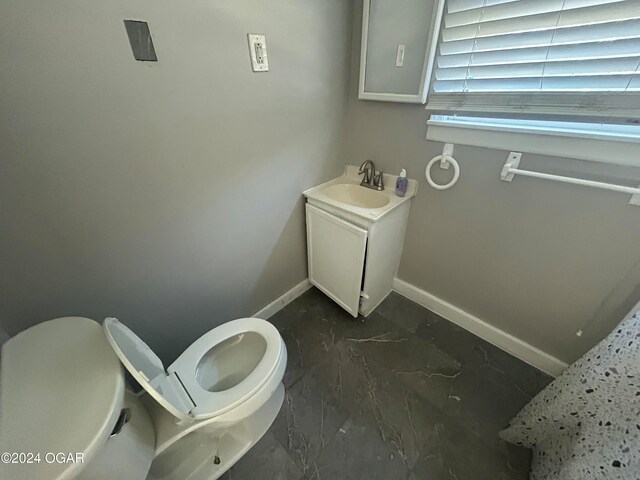 bathroom with vanity and toilet