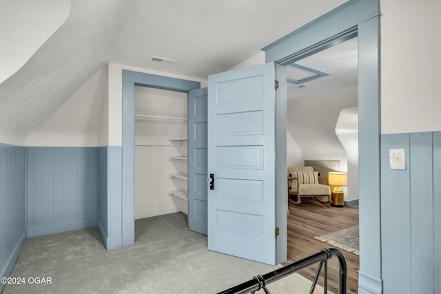 bonus room featuring light hardwood / wood-style floors and lofted ceiling