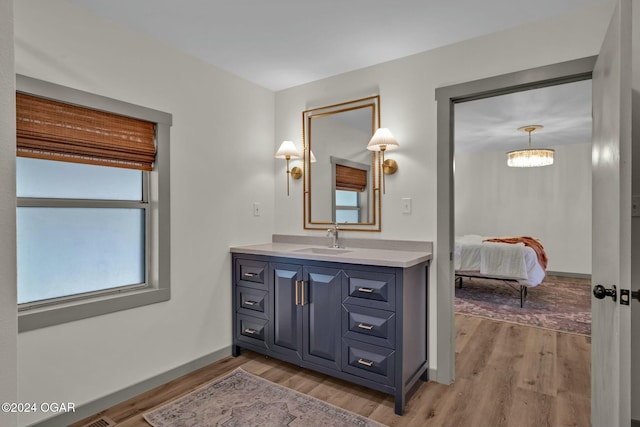 bathroom featuring vanity and hardwood / wood-style flooring