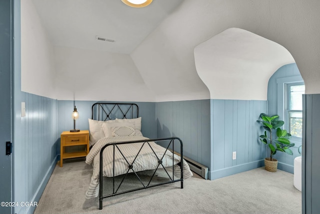 bedroom with carpet flooring and lofted ceiling