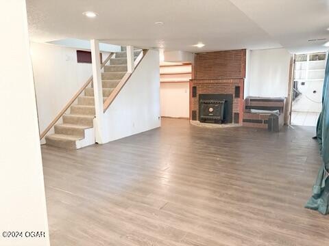 unfurnished living room with wood-type flooring