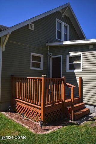 rear view of property with a deck