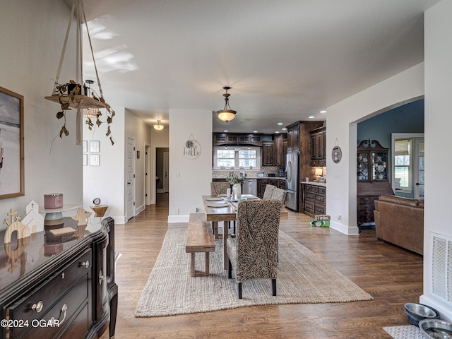 dining space with light hardwood / wood-style floors