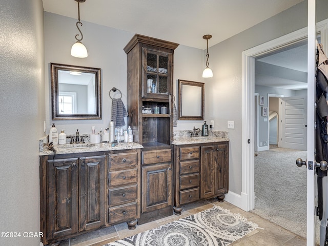 bathroom with tile patterned floors and vanity