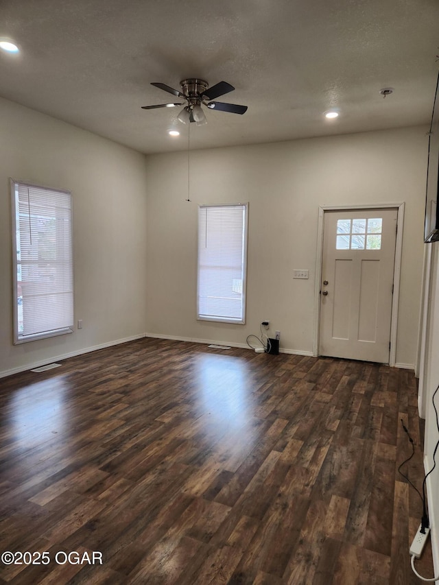 foyer entrance with recessed lighting, baseboards, and dark wood-style flooring