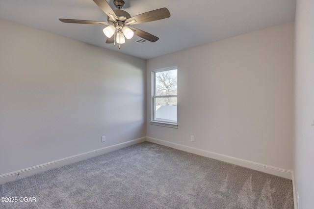 carpeted spare room with ceiling fan