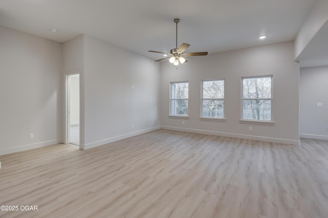 empty room featuring light hardwood / wood-style floors and ceiling fan