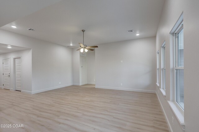 unfurnished room featuring light hardwood / wood-style floors and ceiling fan