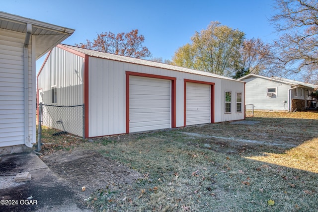 garage with a yard