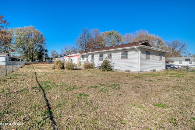 back of property with a yard